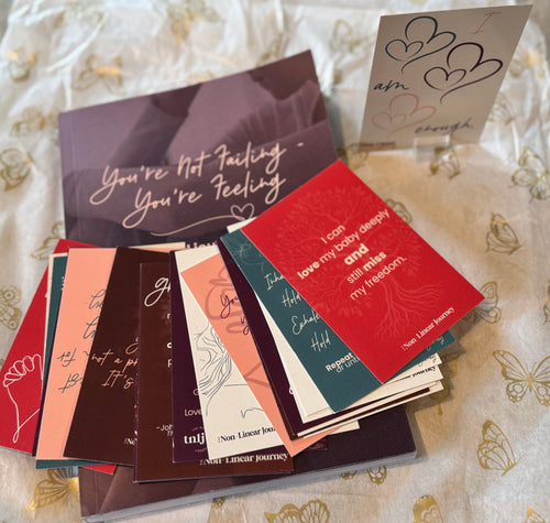 Collection of small books with various messages on a patterned surface