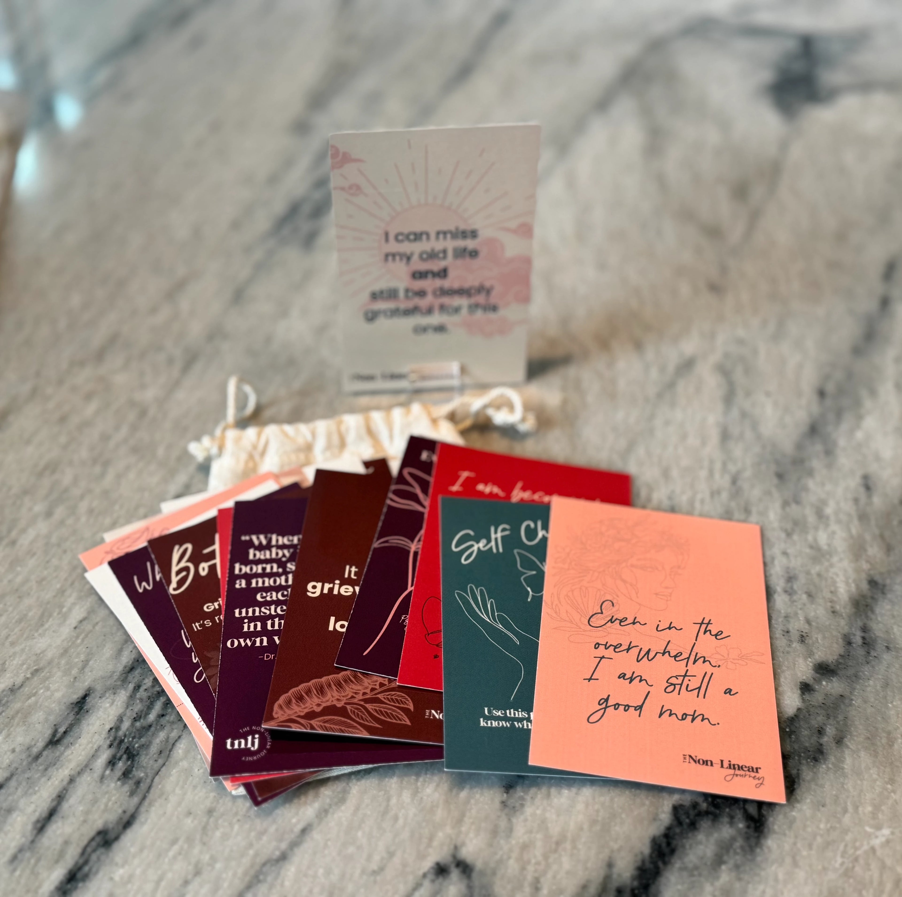 Stack of small cards with text on a marble surface